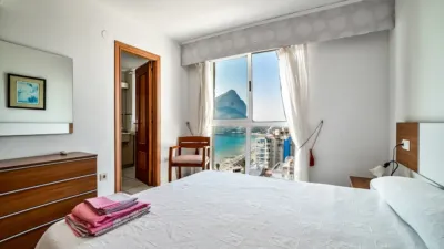 Duplex penthouse on the first line of La Fossa beach, 15th and 16th floors. Close to supermarkets and the urban bus stop. It has 150 square meters built, distributed in three bedrooms, three bathrooms, kitchen and living room with a 63-square-meter terrace with 360-degree views of all of Calpe. The apartment is located in a building with a community pool with direct access to the seaside promenade, social club and green areas where you can sunbathe or simply relax. photo 15