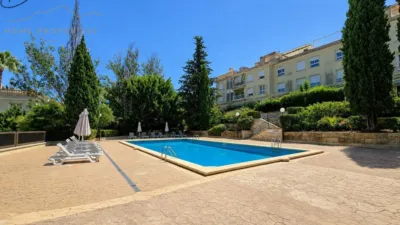 Ground floor apartment with two terraces, swimming pools, parking and storage room in La Bonanova. Living in La Bonanova means enjoying one of the most valued residential areas in Palma, combining tranquility, good transport links and proximity to all amenities. In this privileged setting we find this attractive ground floor apartment with two bedrooms and two terraces, located in a well-kept high-end residential complex. The property stands out for its outdoor spaces, its good layout and the quality of its finishes, making it an excellent option both as a main residence and as a second home in Mallorca. The interior is arranged with two bedrooms, both with direct access to the terrace, and two bathrooms. It also features built-in wardrobes and parquet flooring, adding warmth and functionality to the different rooms. The living room connects to the kitchen, creating a comfortable and practical day zone, and the apartment also includes a separate laundry area. One of its main attractions is its two private terraces. The terrace connected directly to the living room offers space for an outdoor dining area, perfect for enjoying dinners, gatherings with friends or simply relaxing outdoors. From here you can even admire the characteristic silhouette of Bellver Castle, adding special appeal to the surroundings. The property also has a second terrace, connected to the ground floor, considerably expanding the possibilities for enjoying the outdoors for much of the year. The residential complex offers well-maintained communal areas with two large swimming pools, perfectly kept gardens, rest areas with benches and various spaces designed to enjoy the environment and leisure time with family. The apartment also includes a parking space and storage room, two particularly practical and valued features in this area of Palma. La Bonanova is one of the residential areas with the highest demand in the city thanks to its tranquility, excellent location and quick connections to the main access routes to Palma. Its proximity to Queens College is also noteworthy, making this location especially interesting for families and international buyers looking to establish their residence near an international school. A property particularly suited for those seeking quality of life, outdoor spaces, communal areas and a privileged location in Palma de Mallorca, whether as a main residence or second home. Contact us for more information and to view this property and its terraces in person in one of the most attractive areas of La Bonanova. The price includes the agency fees, payable by the seller. It does not include taxes or purchase costs — ITP or VAT/AJD, notary and registration — which will be borne by the buyer. Their amount will depend on the value of the transaction and the personal circumstances of the purchaser. photo 10