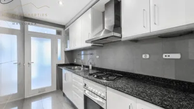 Ground floor apartment with two terraces, swimming pools, parking and storage room in La Bonanova. Living in La Bonanova means enjoying one of the most valued residential areas in Palma, combining tranquility, good transport links and proximity to all amenities. In this privileged setting we find this attractive ground floor apartment with two bedrooms and two terraces, located in a well-kept high-end residential complex. The property stands out for its outdoor spaces, its good layout and the quality of its finishes, making it an excellent option both as a main residence and as a second home in Mallorca. The interior is arranged with two bedrooms, both with direct access to the terrace, and two bathrooms. It also features built-in wardrobes and parquet flooring, adding warmth and functionality to the different rooms. The living room connects to the kitchen, creating a comfortable and practical day zone, and the apartment also includes a separate laundry area. One of its main attractions is its two private terraces. The terrace connected directly to the living room offers space for an outdoor dining area, perfect for enjoying dinners, gatherings with friends or simply relaxing outdoors. From here you can even admire the characteristic silhouette of Bellver Castle, adding special appeal to the surroundings. The property also has a second terrace, connected to the ground floor, considerably expanding the possibilities for enjoying the outdoors for much of the year. The residential complex offers well-maintained communal areas with two large swimming pools, perfectly kept gardens, rest areas with benches and various spaces designed to enjoy the environment and leisure time with family. The apartment also includes a parking space and storage room, two particularly practical and valued features in this area of Palma. La Bonanova is one of the residential areas with the highest demand in the city thanks to its tranquility, excellent location and quick connections to the main access routes to Palma. Its proximity to Queens College is also noteworthy, making this location especially interesting for families and international buyers looking to establish their residence near an international school. A property particularly suited for those seeking quality of life, outdoor spaces, communal areas and a privileged location in Palma de Mallorca, whether as a main residence or second home. Contact us for more information and to view this property and its terraces in person in one of the most attractive areas of La Bonanova. The price includes the agency fees, payable by the seller. It does not include taxes or purchase costs — ITP or VAT/AJD, notary and registration — which will be borne by the buyer. Their amount will depend on the value of the transaction and the personal circumstances of the purchaser. photo 9