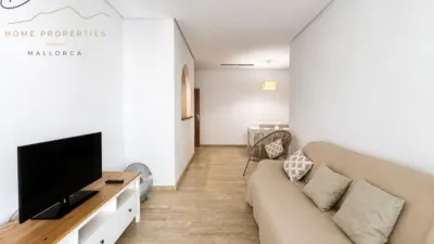 Ground floor apartment with two terraces, swimming pools, parking and storage room in La Bonanova. Living in La Bonanova means enjoying one of the most valued residential areas in Palma, combining tranquility, good transport links and proximity to all amenities. In this privileged setting we find this attractive ground floor apartment with two bedrooms and two terraces, located in a well-kept high-end residential complex. The property stands out for its outdoor spaces, its good layout and the quality of its finishes, making it an excellent option both as a main residence and as a second home in Mallorca. The interior is arranged with two bedrooms, both with direct access to the terrace, and two bathrooms. It also features built-in wardrobes and parquet flooring, adding warmth and functionality to the different rooms. The living room connects to the kitchen, creating a comfortable and practical day zone, and the apartment also includes a separate laundry area. One of its main attractions is its two private terraces. The terrace connected directly to the living room offers space for an outdoor dining area, perfect for enjoying dinners, gatherings with friends or simply relaxing outdoors. From here you can even admire the characteristic silhouette of Bellver Castle, adding special appeal to the surroundings. The property also has a second terrace, connected to the ground floor, considerably expanding the possibilities for enjoying the outdoors for much of the year. The residential complex offers well-maintained communal areas with two large swimming pools, perfectly kept gardens, rest areas with benches and various spaces designed to enjoy the environment and leisure time with family. The apartment also includes a parking space and storage room, two particularly practical and valued features in this area of Palma. La Bonanova is one of the residential areas with the highest demand in the city thanks to its tranquility, excellent location and quick connections to the main access routes to Palma. Its proximity to Queens College is also noteworthy, making this location especially interesting for families and international buyers looking to establish their residence near an international school. A property particularly suited for those seeking quality of life, outdoor spaces, communal areas and a privileged location in Palma de Mallorca, whether as a main residence or second home. Contact us for more information and to view this property and its terraces in person in one of the most attractive areas of La Bonanova. The price includes the agency fees, payable by the seller. It does not include taxes or purchase costs — ITP or VAT/AJD, notary and registration — which will be borne by the buyer. Their amount will depend on the value of the transaction and the personal circumstances of the purchaser. photo 6