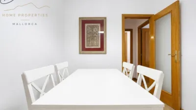 Ground floor apartment with two terraces, swimming pools, parking and storage room in La Bonanova. Living in La Bonanova means enjoying one of the most valued residential areas in Palma, combining tranquility, good transport links and proximity to all amenities. In this privileged setting we find this attractive ground floor apartment with two bedrooms and two terraces, located in a well-kept high-end residential complex. The property stands out for its outdoor spaces, its good layout and the quality of its finishes, making it an excellent option both as a main residence and as a second home in Mallorca. The interior is arranged with two bedrooms, both with direct access to the terrace, and two bathrooms. It also features built-in wardrobes and parquet flooring, adding warmth and functionality to the different rooms. The living room connects to the kitchen, creating a comfortable and practical day zone, and the apartment also includes a separate laundry area. One of its main attractions is its two private terraces. The terrace connected directly to the living room offers space for an outdoor dining area, perfect for enjoying dinners, gatherings with friends or simply relaxing outdoors. From here you can even admire the characteristic silhouette of Bellver Castle, adding special appeal to the surroundings. The property also has a second terrace, connected to the ground floor, considerably expanding the possibilities for enjoying the outdoors for much of the year. The residential complex offers well-maintained communal areas with two large swimming pools, perfectly kept gardens, rest areas with benches and various spaces designed to enjoy the environment and leisure time with family. The apartment also includes a parking space and storage room, two particularly practical and valued features in this area of Palma. La Bonanova is one of the residential areas with the highest demand in the city thanks to its tranquility, excellent location and quick connections to the main access routes to Palma. Its proximity to Queens College is also noteworthy, making this location especially interesting for families and international buyers looking to establish their residence near an international school. A property particularly suited for those seeking quality of life, outdoor spaces, communal areas and a privileged location in Palma de Mallorca, whether as a main residence or second home. Contact us for more information and to view this property and its terraces in person in one of the most attractive areas of La Bonanova. The price includes the agency fees, payable by the seller. It does not include taxes or purchase costs — ITP or VAT/AJD, notary and registration — which will be borne by the buyer. Their amount will depend on the value of the transaction and the personal circumstances of the purchaser. photo 13