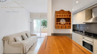 Ground floor apartment with two terraces, swimming pools, parking and storage room in La Bonanova. Living in La Bonanova means enjoying one of the most valued residential areas in Palma, combining tranquility, good transport links and proximity to all amenities. In this privileged setting we find this attractive ground floor apartment with two bedrooms and two terraces, located in a well-kept high-end residential complex. The property stands out for its outdoor spaces, its good layout and the quality of its finishes, making it an excellent option both as a main residence and as a second home in Mallorca. The interior is arranged with two bedrooms, both with direct access to the terrace, and two bathrooms. It also features built-in wardrobes and parquet flooring, adding warmth and functionality to the different rooms. The living room connects to the kitchen, creating a comfortable and practical day zone, and the apartment also includes a separate laundry area. One of its main attractions is its two private terraces. The terrace connected directly to the living room offers space for an outdoor dining area, perfect for enjoying dinners, gatherings with friends or simply relaxing outdoors. From here you can even admire the characteristic silhouette of Bellver Castle, adding special appeal to the surroundings. The property also has a second terrace, connected to the ground floor, considerably expanding the possibilities for enjoying the outdoors for much of the year. The residential complex offers well-maintained communal areas with two large swimming pools, perfectly kept gardens, rest areas with benches and various spaces designed to enjoy the environment and leisure time with family. The apartment also includes a parking space and storage room, two particularly practical and valued features in this area of Palma. La Bonanova is one of the residential areas with the highest demand in the city thanks to its tranquility, excellent location and quick connections to the main access routes to Palma. Its proximity to Queens College is also noteworthy, making this location especially interesting for families and international buyers looking to establish their residence near an international school. A property particularly suited for those seeking quality of life, outdoor spaces, communal areas and a privileged location in Palma de Mallorca, whether as a main residence or second home. Contact us for more information and to view this property and its terraces in person in one of the most attractive areas of La Bonanova. The price includes the agency fees, payable by the seller. It does not include taxes or purchase costs — ITP or VAT/AJD, notary and registration — which will be borne by the buyer. Their amount will depend on the value of the transaction and the personal circumstances of the purchaser. photo 15