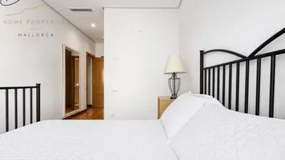 Ground floor apartment with two terraces, swimming pools, parking and storage room in La Bonanova. Living in La Bonanova means enjoying one of the most valued residential areas in Palma, combining tranquility, good transport links and proximity to all amenities. In this privileged setting we find this attractive ground floor apartment with two bedrooms and two terraces, located in a well-kept high-end residential complex. The property stands out for its outdoor spaces, its good layout and the quality of its finishes, making it an excellent option both as a main residence and as a second home in Mallorca. The interior is arranged with two bedrooms, both with direct access to the terrace, and two bathrooms. It also features built-in wardrobes and parquet flooring, adding warmth and functionality to the different rooms. The living room connects to the kitchen, creating a comfortable and practical day zone, and the apartment also includes a separate laundry area. One of its main attractions is its two private terraces. The terrace connected directly to the living room offers space for an outdoor dining area, perfect for enjoying dinners, gatherings with friends or simply relaxing outdoors. From here you can even admire the characteristic silhouette of Bellver Castle, adding special appeal to the surroundings. The property also has a second terrace, connected to the ground floor, considerably expanding the possibilities for enjoying the outdoors for much of the year. The residential complex offers well-maintained communal areas with two large swimming pools, perfectly kept gardens, rest areas with benches and various spaces designed to enjoy the environment and leisure time with family. The apartment also includes a parking space and storage room, two particularly practical and valued features in this area of Palma. La Bonanova is one of the residential areas with the highest demand in the city thanks to its tranquility, excellent location and quick connections to the main access routes to Palma. Its proximity to Queens College is also noteworthy, making this location especially interesting for families and international buyers looking to establish their residence near an international school. A property particularly suited for those seeking quality of life, outdoor spaces, communal areas and a privileged location in Palma de Mallorca, whether as a main residence or second home. Contact us for more information and to view this property and its terraces in person in one of the most attractive areas of La Bonanova. The price includes the agency fees, payable by the seller. It does not include taxes or purchase costs — ITP or VAT/AJD, notary and registration — which will be borne by the buyer. Their amount will depend on the value of the transaction and the personal circumstances of the purchaser. photo 21