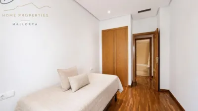 Ground floor apartment with two terraces, swimming pools, parking and storage room in La Bonanova. Living in La Bonanova means enjoying one of the most valued residential areas in Palma, combining tranquility, good transport links and proximity to all amenities. In this privileged setting we find this attractive ground floor apartment with two bedrooms and two terraces, located in a well-kept high-end residential complex. The property stands out for its outdoor spaces, its good layout and the quality of its finishes, making it an excellent option both as a main residence and as a second home in Mallorca. The interior is arranged with two bedrooms, both with direct access to the terrace, and two bathrooms. It also features built-in wardrobes and parquet flooring, adding warmth and functionality to the different rooms. The living room connects to the kitchen, creating a comfortable and practical day zone, and the apartment also includes a separate laundry area. One of its main attractions is its two private terraces. The terrace connected directly to the living room offers space for an outdoor dining area, perfect for enjoying dinners, gatherings with friends or simply relaxing outdoors. From here you can even admire the characteristic silhouette of Bellver Castle, adding special appeal to the surroundings. The property also has a second terrace, connected to the ground floor, considerably expanding the possibilities for enjoying the outdoors for much of the year. The residential complex offers well-maintained communal areas with two large swimming pools, perfectly kept gardens, rest areas with benches and various spaces designed to enjoy the environment and leisure time with family. The apartment also includes a parking space and storage room, two particularly practical and valued features in this area of Palma. La Bonanova is one of the residential areas with the highest demand in the city thanks to its tranquility, excellent location and quick connections to the main access routes to Palma. Its proximity to Queens College is also noteworthy, making this location especially interesting for families and international buyers looking to establish their residence near an international school. A property particularly suited for those seeking quality of life, outdoor spaces, communal areas and a privileged location in Palma de Mallorca, whether as a main residence or second home. Contact us for more information and to view this property and its terraces in person in one of the most attractive areas of La Bonanova. The price includes the agency fees, payable by the seller. It does not include taxes or purchase costs — ITP or VAT/AJD, notary and registration — which will be borne by the buyer. Their amount will depend on the value of the transaction and the personal circumstances of the purchaser. photo 23