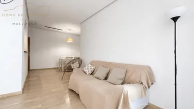 Ground floor apartment with two terraces, swimming pools, parking and storage room in La Bonanova. Living in La Bonanova means enjoying one of the most valued residential areas in Palma, combining tranquility, good transport links and proximity to all amenities. In this privileged setting we find this attractive ground floor apartment with two bedrooms and two terraces, located in a well-kept high-end residential complex. The property stands out for its outdoor spaces, its good layout and the quality of its finishes, making it an excellent option both as a main residence and as a second home in Mallorca. The interior is arranged with two bedrooms, both with direct access to the terrace, and two bathrooms. It also features built-in wardrobes and parquet flooring, adding warmth and functionality to the different rooms. The living room connects to the kitchen, creating a comfortable and practical day zone, and the apartment also includes a separate laundry area. One of its main attractions is its two private terraces. The terrace connected directly to the living room offers space for an outdoor dining area, perfect for enjoying dinners, gatherings with friends or simply relaxing outdoors. From here you can even admire the characteristic silhouette of Bellver Castle, adding special appeal to the surroundings. The property also has a second terrace, connected to the ground floor, considerably expanding the possibilities for enjoying the outdoors for much of the year. The residential complex offers well-maintained communal areas with two large swimming pools, perfectly kept gardens, rest areas with benches and various spaces designed to enjoy the environment and leisure time with family. The apartment also includes a parking space and storage room, two particularly practical and valued features in this area of Palma. La Bonanova is one of the residential areas with the highest demand in the city thanks to its tranquility, excellent location and quick connections to the main access routes to Palma. Its proximity to Queens College is also noteworthy, making this location especially interesting for families and international buyers looking to establish their residence near an international school. A property particularly suited for those seeking quality of life, outdoor spaces, communal areas and a privileged location in Palma de Mallorca, whether as a main residence or second home. Contact us for more information and to view this property and its terraces in person in one of the most attractive areas of La Bonanova. The price includes the agency fees, payable by the seller. It does not include taxes or purchase costs — ITP or VAT/AJD, notary and registration — which will be borne by the buyer. Their amount will depend on the value of the transaction and the personal circumstances of the purchaser. photo 14