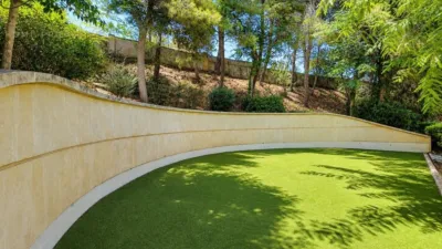 Ground floor apartment with two terraces, swimming pools, parking and storage room in La Bonanova. Living in La Bonanova means enjoying one of the most valued residential areas in Palma, combining tranquility, good transport links and proximity to all amenities. In this privileged setting we find this attractive ground floor apartment with two bedrooms and two terraces, located in a well-kept high-end residential complex. The property stands out for its outdoor spaces, its good layout and the quality of its finishes, making it an excellent option both as a main residence and as a second home in Mallorca. The interior is arranged with two bedrooms, both with direct access to the terrace, and two bathrooms. It also features built-in wardrobes and parquet flooring, adding warmth and functionality to the different rooms. The living room connects to the kitchen, creating a comfortable and practical day zone, and the apartment also includes a separate laundry area. One of its main attractions is its two private terraces. The terrace connected directly to the living room offers space for an outdoor dining area, perfect for enjoying dinners, gatherings with friends or simply relaxing outdoors. From here you can even admire the characteristic silhouette of Bellver Castle, adding special appeal to the surroundings. The property also has a second terrace, connected to the ground floor, considerably expanding the possibilities for enjoying the outdoors for much of the year. The residential complex offers well-maintained communal areas with two large swimming pools, perfectly kept gardens, rest areas with benches and various spaces designed to enjoy the environment and leisure time with family. The apartment also includes a parking space and storage room, two particularly practical and valued features in this area of Palma. La Bonanova is one of the residential areas with the highest demand in the city thanks to its tranquility, excellent location and quick connections to the main access routes to Palma. Its proximity to Queens College is also noteworthy, making this location especially interesting for families and international buyers looking to establish their residence near an international school. A property particularly suited for those seeking quality of life, outdoor spaces, communal areas and a privileged location in Palma de Mallorca, whether as a main residence or second home. Contact us for more information and to view this property and its terraces in person in one of the most attractive areas of La Bonanova. The price includes the agency fees, payable by the seller. It does not include taxes or purchase costs — ITP or VAT/AJD, notary and registration — which will be borne by the buyer. Their amount will depend on the value of the transaction and the personal circumstances of the purchaser. photo 31