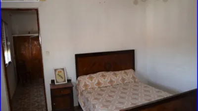House for sale in La Matanza, Orihuela. This property comprises a residential house of 152 m² and a separate commercial unit with storage space of 142 m² built area, both situated on a 1000 m² plot. The residence features three double bedrooms, one single bedroom, a living room, a sitting room, an equipped kitchen, one bathroom, and a patio with a laundry area. The commercial and storage building is fully finished. Interior joinery is made of sapeli wood, it has an east-facing orientation, porcelain tile flooring, and exterior joinery combining aluminium and wood. Extras include water, electricity, furniture, terrace, and storage room. Located close to medical centres, rural amenities, supermarkets, and pharmacies. photo 13