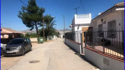 House for sale in La Matanza, Orihuela. This property comprises a residential house of 152 m² and a separate commercial unit with storage space of 142 m² built area, both situated on a 1000 m² plot. The residence features three double bedrooms, one single bedroom, a living room, a sitting room, an equipped kitchen, one bathroom, and a patio with a laundry area. The commercial and storage building is fully finished. Interior joinery is made of sapeli wood, it has an east-facing orientation, porcelain tile flooring, and exterior joinery combining aluminium and wood. Extras include water, electricity, furniture, terrace, and storage room. Located close to medical centres, rural amenities, supermarkets, and pharmacies. photo 27