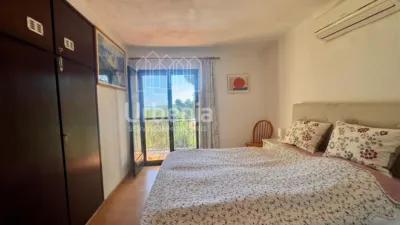 Apialia offers this fantastic rustic property with sea views, located on a plot of nearly 6,000 m² in Lloret de Mar, just 10 minutes by car from the beach. Surrounded by nature and offering total privacy, this home provides a unique setting with open views of the sea and hills, for those seeking tranquility without sacrificing proximity to the coast. The house is in perfect condition, with 214 m² built across two floors. It features four double bedrooms, all equipped with air conditioning and fitted wardrobes, and two full bathrooms. photo 19
