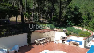 Apialia offers this fantastic rustic property with sea views, located on a plot of nearly 6,000 m² in Lloret de Mar, just 10 minutes by car from the beach. Surrounded by nature and offering total privacy, this home provides a unique setting with open views of the sea and hills, for those seeking tranquility without sacrificing proximity to the coast. The house is in perfect condition, with 214 m² built across two floors. It features four double bedrooms, all equipped with air conditioning and fitted wardrobes, and two full bathrooms. photo 3