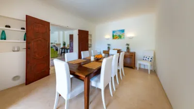 Luxury rural finca in one of Pollença’s most sought-after areas. Built in 2003, this property sits on a plot of 53,600m² with approximately 540m² of built space. The main house features a bedroom on the ground floor, a living room with a fireplace, a separate dining room, and a large kitchen with a pantry and laundry room, all overlooking the garden. Access to the garage, which can accommodate two large cars, is also on this level. photo 10