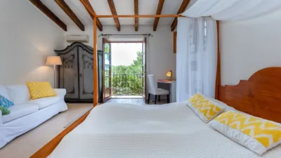 Luxury rural finca in one of Pollença’s most sought-after areas. Built in 2003, this property sits on a plot of 53,600m² with approximately 540m² of built space. The main house features a bedroom on the ground floor, a living room with a fireplace, a separate dining room, and a large kitchen with a pantry and laundry room, all overlooking the garden. Access to the garage, which can accommodate two large cars, is also on this level. photo 14