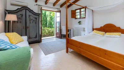 Luxury rural finca in one of Pollença’s most sought-after areas. Built in 2003, this property sits on a plot of 53,600m² with approximately 540m² of built space. The main house features a bedroom on the ground floor, a living room with a fireplace, a separate dining room, and a large kitchen with a pantry and laundry room, all overlooking the garden. Access to the garage, which can accommodate two large cars, is also on this level. photo 15
