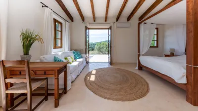 Luxury rural finca in one of Pollença’s most sought-after areas. Built in 2003, this property sits on a plot of 53,600m² with approximately 540m² of built space. The main house features a bedroom on the ground floor, a living room with a fireplace, a separate dining room, and a large kitchen with a pantry and laundry room, all overlooking the garden. Access to the garage, which can accommodate two large cars, is also on this level. photo 16