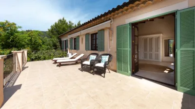 Luxury rural finca in one of Pollença’s most sought-after areas. Built in 2003, this property sits on a plot of 53,600m² with approximately 540m² of built space. The main house features a bedroom on the ground floor, a living room with a fireplace, a separate dining room, and a large kitchen with a pantry and laundry room, all overlooking the garden. Access to the garage, which can accommodate two large cars, is also on this level. photo 18