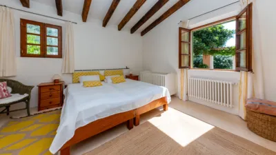 Luxury rural finca in one of Pollença’s most sought-after areas. Built in 2003, this property sits on a plot of 53,600m² with approximately 540m² of built space. The main house features a bedroom on the ground floor, a living room with a fireplace, a separate dining room, and a large kitchen with a pantry and laundry room, all overlooking the garden. Access to the garage, which can accommodate two large cars, is also on this level. photo 20