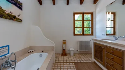 Luxury rural finca in one of Pollença’s most sought-after areas. Built in 2003, this property sits on a plot of 53,600m² with approximately 540m² of built space. The main house features a bedroom on the ground floor, a living room with a fireplace, a separate dining room, and a large kitchen with a pantry and laundry room, all overlooking the garden. Access to the garage, which can accommodate two large cars, is also on this level. photo 23