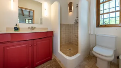 Luxury rural finca in one of Pollença’s most sought-after areas. Built in 2003, this property sits on a plot of 53,600m² with approximately 540m² of built space. The main house features a bedroom on the ground floor, a living room with a fireplace, a separate dining room, and a large kitchen with a pantry and laundry room, all overlooking the garden. Access to the garage, which can accommodate two large cars, is also on this level. photo 24