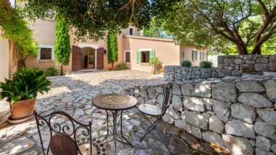 Luxury rural finca in one of Pollença’s most sought-after areas. Built in 2003, this property sits on a plot of 53,600m² with approximately 540m² of built space. The main house features a bedroom on the ground floor, a living room with a fireplace, a separate dining room, and a large kitchen with a pantry and laundry room, all overlooking the garden. Access to the garage, which can accommodate two large cars, is also on this level. photo 31