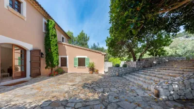 Luxury rural finca in one of Pollença’s most sought-after areas. Built in 2003, this property sits on a plot of 53,600m² with approximately 540m² of built space. The main house features a bedroom on the ground floor, a living room with a fireplace, a separate dining room, and a large kitchen with a pantry and laundry room, all overlooking the garden. Access to the garage, which can accommodate two large cars, is also on this level. photo 33