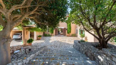 Luxury rural finca in one of Pollença’s most sought-after areas. Built in 2003, this property sits on a plot of 53,600m² with approximately 540m² of built space. The main house features a bedroom on the ground floor, a living room with a fireplace, a separate dining room, and a large kitchen with a pantry and laundry room, all overlooking the garden. Access to the garage, which can accommodate two large cars, is also on this level. photo 34