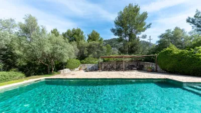 Luxury rural finca in one of Pollença’s most sought-after areas. Built in 2003, this property sits on a plot of 53,600m² with approximately 540m² of built space. The main house features a bedroom on the ground floor, a living room with a fireplace, a separate dining room, and a large kitchen with a pantry and laundry room, all overlooking the garden. Access to the garage, which can accommodate two large cars, is also on this level. photo 35