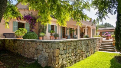 Luxury rural finca in one of Pollença’s most sought-after areas. Built in 2003, this property sits on a plot of 53,600m² with approximately 540m² of built space. The main house features a bedroom on the ground floor, a living room with a fireplace, a separate dining room, and a large kitchen with a pantry and laundry room, all overlooking the garden. Access to the garage, which can accommodate two large cars, is also on this level. photo 37