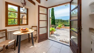 Luxury rural finca in one of Pollença’s most sought-after areas. Built in 2003, this property sits on a plot of 53,600m² with approximately 540m² of built space. The main house features a bedroom on the ground floor, a living room with a fireplace, a separate dining room, and a large kitchen with a pantry and laundry room, all overlooking the garden. Access to the garage, which can accommodate two large cars, is also on this level. photo 4