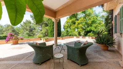 Luxury rural finca in one of Pollença’s most sought-after areas. Built in 2003, this property sits on a plot of 53,600m² with approximately 540m² of built space. The main house features a bedroom on the ground floor, a living room with a fireplace, a separate dining room, and a large kitchen with a pantry and laundry room, all overlooking the garden. Access to the garage, which can accommodate two large cars, is also on this level. photo 5