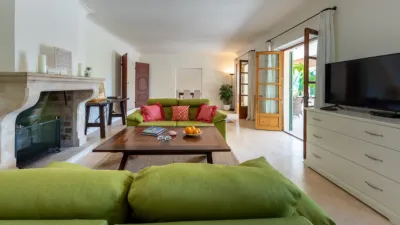 Luxury rural finca in one of Pollença’s most sought-after areas. Built in 2003, this property sits on a plot of 53,600m² with approximately 540m² of built space. The main house features a bedroom on the ground floor, a living room with a fireplace, a separate dining room, and a large kitchen with a pantry and laundry room, all overlooking the garden. Access to the garage, which can accommodate two large cars, is also on this level. photo 7
