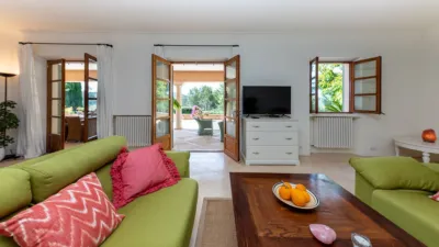 Luxury rural finca in one of Pollença’s most sought-after areas. Built in 2003, this property sits on a plot of 53,600m² with approximately 540m² of built space. The main house features a bedroom on the ground floor, a living room with a fireplace, a separate dining room, and a large kitchen with a pantry and laundry room, all overlooking the garden. Access to the garage, which can accommodate two large cars, is also on this level. photo 9