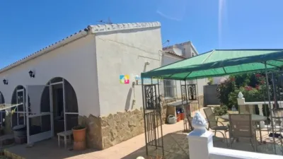 Villa for sale in Los Carrascos, Arboleas. A spacious 3-bedroom villa located in the highly sought-after area of Los Carrascos, Arboleas, offering privacy, generous outdoor areas and a peaceful setting. The property is fully enclosed with a gated entrance. Situated on a quiet side street, it borders an open plot. The house comprises 3 bedrooms, one with an en-suite bathroom, and air conditioning installed in 5 rooms. It features a large living room with a fireplace, a separate dining area, and a fully equipped kitchen. A spacious enclosed external terrace provides additional space for relaxation and entertaining, opening directly onto the pool area. At the rear, there is a large terrace adjacent to the swimming pool, complete with an outdoor shower. To the front, another terrace benefits from a pergola, while the side of the house includes a private, walled garden with mature flowers. There is also a garden storage room. In the front of the property, a driveway offers parking space for one car. The villa is sold unfurnished, although the owner is willing to negotiate on furniture if required. The property requires some improvements and redecoration, though these are purely cosmetic. The owner is open to offers, making this an excellent opportunity for those looking to personalise and adapt a villa to their taste. A lovely home in a tranquil location, featuring a private pool, expansive terraces and plenty of potential. photo 5