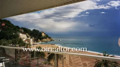 Luxury apartment for sale on the first line of the sea in Lloret de Mar. It has a surface area of 200 m2 and is distributed in a spacious and bright living-dining room with a large terrace and unforgettable views of the sea, four bedrooms, two en suite, master bedroom with open sea view, spacious kitchen fully equipped with MIELE design furniture. The flat has a large entrance hall and large living-dining room with fireplace and terrace with sea views. The bathrooms have 1st quality ceramic pieces and bathtubs. The property is equipped with the following qualities and finishes such as air conditioning with heat pump, all rooms are exterior with built-in wardrobes and marble floors. The exterior carpentry is aluminum with double “climalite” glass. It also has a reinforced door and alarm. The location is very privileged in a building of 6 floors, one apartment per floor with direct access to the elevator. All terraces offer wonderful clear views of the beach, the castle of Lloret de Mar, the San Joan tower and the seaside promenade. A selection to enjoy the beauty of the Coast and the atmosphere of the Mediterranean Lloret de Mar is a Spanish municipality in the Selva region, in the province of Girona, Catalonia and next to the sea, on the Costa Brava. It has excellent granulated sand beaches. It also has magnificent views of the castle at one end and at the other the monument to "La dona Marinera" which represents the suffering of women waiting for the return of their fishing husbands. Also places to visit such as: - Church of San Román: Gothic church with Renaissance influences built between 1509 and 1522. It presents some typical characteristics of a fortification, such as the drawbridge door. - Santa Clotilde Gardens: The Santa Clotilde Gardens, which were completed in 1919, are the work of builder Nicolau Maria Rubió i Tudurí. photo 2