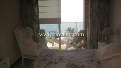 Luxury apartment for sale on the first line of the sea in Lloret de Mar. It has a surface area of 200 m2 and is distributed in a spacious and bright living-dining room with a large terrace and unforgettable views of the sea, four bedrooms, two en suite, master bedroom with open sea view, spacious kitchen fully equipped with MIELE design furniture. The flat has a large entrance hall and large living-dining room with fireplace and terrace with sea views. The bathrooms have 1st quality ceramic pieces and bathtubs. The property is equipped with the following qualities and finishes such as air conditioning with heat pump, all rooms are exterior with built-in wardrobes and marble floors. The exterior carpentry is aluminum with double “climalite” glass. It also has a reinforced door and alarm. The location is very privileged in a building of 6 floors, one apartment per floor with direct access to the elevator. All terraces offer wonderful clear views of the beach, the castle of Lloret de Mar, the San Joan tower and the seaside promenade. A selection to enjoy the beauty of the Coast and the atmosphere of the Mediterranean Lloret de Mar is a Spanish municipality in the Selva region, in the province of Girona, Catalonia and next to the sea, on the Costa Brava. It has excellent granulated sand beaches. It also has magnificent views of the castle at one end and at the other the monument to "La dona Marinera" which represents the suffering of women waiting for the return of their fishing husbands. Also places to visit such as: - Church of San Román: Gothic church with Renaissance influences built between 1509 and 1522. It presents some typical characteristics of a fortification, such as the drawbridge door. - Santa Clotilde Gardens: The Santa Clotilde Gardens, which were completed in 1919, are the work of builder Nicolau Maria Rubió i Tudurí. photo 9