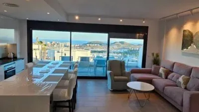 Duplex Penthouse with Dream Views: Infinite Mediterranean Sea Views - Camporosso Village, Finestrat 112 m² interior | 191.51 m² total built-up area | 170.27 m² usable surface 3 bedrooms | 3 bathrooms 82.56 m² of terraces, including a spectacular rooftop solarium of 43.82 m² with jacuzzi Stunning panoramic sea views 1 parking space included Energy Class A - Extremely energy efficient (30 kWh/m²/year) Layout: First Floor (74 m²): Open-plan living-dining room with modern kitchen, 2 bedrooms (master with en-suite bathroom), 2 bathrooms and 16 m² terrace with sea views. Second Floor (29 m²): Spacious third bedroom/multi-purpose room, bathroom, storage room, 16.60 m² terrace, plus an impressive rooftop solarium of 43.82 m² with 180° panoramic sea and Benidorm skyline views! Features: Air conditioning (heating/cooling) | Automatic awnings and electric shutters | Alarm system | Fully equipped modern kitchen | Parking space included | Energy rating A | All furniture included | Complete smart home system controllable via mobile app (electric shutters, all lights, air conditioning, door intercom and more) Community Services: Outdoor and heated swimming pools | Padel court | Gym | Children's playground | Gardens Privileged Location - Calle Colombia 2, Finestrat: 10 min to beaches | Shopping centres and supermarkets | Golf courses | Restaurants | Medical services and schools Perfect for: Families, investors, seekers of Mediterranean lifestyle, permanent or holiday residence, the best of life on the Costa Blanca. A Unique Opportunity: Modern duplex penthouse with A energy certification, huge private rooftop solarium with jacuzzi, smart home technology and all furniture included in one of the most complete urbanisations on the Costa Blanca. photo 14