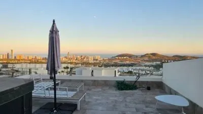 Duplex Penthouse with Dream Views: Infinite Mediterranean Sea Views - Camporosso Village, Finestrat 112 m² interior | 191.51 m² total built-up area | 170.27 m² usable surface 3 bedrooms | 3 bathrooms 82.56 m² of terraces, including a spectacular rooftop solarium of 43.82 m² with jacuzzi Stunning panoramic sea views 1 parking space included Energy Class A - Extremely energy efficient (30 kWh/m²/year) Layout: First Floor (74 m²): Open-plan living-dining room with modern kitchen, 2 bedrooms (master with en-suite bathroom), 2 bathrooms and 16 m² terrace with sea views. Second Floor (29 m²): Spacious third bedroom/multi-purpose room, bathroom, storage room, 16.60 m² terrace, plus an impressive rooftop solarium of 43.82 m² with 180° panoramic sea and Benidorm skyline views! Features: Air conditioning (heating/cooling) | Automatic awnings and electric shutters | Alarm system | Fully equipped modern kitchen | Parking space included | Energy rating A | All furniture included | Complete smart home system controllable via mobile app (electric shutters, all lights, air conditioning, door intercom and more) Community Services: Outdoor and heated swimming pools | Padel court | Gym | Children's playground | Gardens Privileged Location - Calle Colombia 2, Finestrat: 10 min to beaches | Shopping centres and supermarkets | Golf courses | Restaurants | Medical services and schools Perfect for: Families, investors, seekers of Mediterranean lifestyle, permanent or holiday residence, the best of life on the Costa Blanca. A Unique Opportunity: Modern duplex penthouse with A energy certification, huge private rooftop solarium with jacuzzi, smart home technology and all furniture included in one of the most complete urbanisations on the Costa Blanca. photo 43