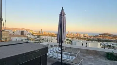 Duplex Penthouse with Dream Views: Infinite Mediterranean Sea Views - Camporosso Village, Finestrat 112 m² interior | 191.51 m² total built-up area | 170.27 m² usable surface 3 bedrooms | 3 bathrooms 82.56 m² of terraces, including a spectacular rooftop solarium of 43.82 m² with jacuzzi Stunning panoramic sea views 1 parking space included Energy Class A - Extremely energy efficient (30 kWh/m²/year) Layout: First Floor (74 m²): Open-plan living-dining room with modern kitchen, 2 bedrooms (master with en-suite bathroom), 2 bathrooms and 16 m² terrace with sea views. Second Floor (29 m²): Spacious third bedroom/multi-purpose room, bathroom, storage room, 16.60 m² terrace, plus an impressive rooftop solarium of 43.82 m² with 180° panoramic sea and Benidorm skyline views! Features: Air conditioning (heating/cooling) | Automatic awnings and electric shutters | Alarm system | Fully equipped modern kitchen | Parking space included | Energy rating A | All furniture included | Complete smart home system controllable via mobile app (electric shutters, all lights, air conditioning, door intercom and more) Community Services: Outdoor and heated swimming pools | Padel court | Gym | Children's playground | Gardens Privileged Location - Calle Colombia 2, Finestrat: 10 min to beaches | Shopping centres and supermarkets | Golf courses | Restaurants | Medical services and schools Perfect for: Families, investors, seekers of Mediterranean lifestyle, permanent or holiday residence, the best of life on the Costa Blanca. A Unique Opportunity: Modern duplex penthouse with A energy certification, huge private rooftop solarium with jacuzzi, smart home technology and all furniture included in one of the most complete urbanisations on the Costa Blanca. photo 44