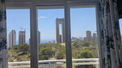 Loft for sale in Terramar Community, Benidorm. Located in Poniente, south-facing. €3,125/m². Opposite the Intempo building in Benidorm. Surrounded by green areas and a golf course. 2 bathrooms: 1 WC + 1 shower room. Walk-in closet. Fully equipped kitchen with high-quality Bosch appliances. The kitchen and dining area form a comfortable and cozy loft, complete with a leather sofa bed. Terrace with beautiful exterior views. Fully external apartment with plenty of natural light. Includes parking space. Storage room (2 × 2 m²). Elevator. Air conditioning-heating. 3 outdoor pools. 1 indoor heated pool. Full gym with showers. 4 WCs. 2 tennis-padel courts. Ping-pong table. Walking paths within the complex with benches. Alarm system installed. photo 20