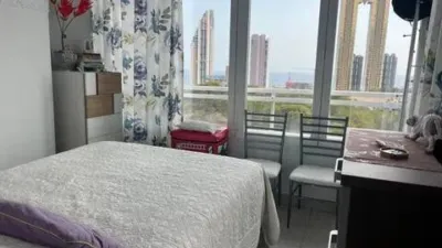 Loft for sale in Terramar Community, Benidorm. Located in Poniente, south-facing. €3,125/m². Opposite the Intempo building in Benidorm. Surrounded by green areas and a golf course. 2 bathrooms: 1 WC + 1 shower room. Walk-in closet. Fully equipped kitchen with high-quality Bosch appliances. The kitchen and dining area form a comfortable and cozy loft, complete with a leather sofa bed. Terrace with beautiful exterior views. Fully external apartment with plenty of natural light. Includes parking space. Storage room (2 × 2 m²). Elevator. Air conditioning-heating. 3 outdoor pools. 1 indoor heated pool. Full gym with showers. 4 WCs. 2 tennis-padel courts. Ping-pong table. Walking paths within the complex with benches. Alarm system installed. photo 27