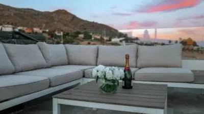 Duplex Penthouse with Dream Views: Infinite Mediterranean Sea Views - Camporosso Village, Finestrat 112 m² interior | 191.51 m² total built-up area | 170.27 m² usable surface 3 bedrooms | 3 bathrooms 82.56 m² of terraces, including a spectacular rooftop solarium of 43.82 m² with jacuzzi Stunning panoramic sea views 1 parking space included Energy Class A - Extremely energy efficient (30 kWh/m²/year) Layout: First Floor (74 m²): Open-plan living-dining room with modern kitchen, 2 bedrooms (master with en-suite bathroom), 2 bathrooms and 16 m² terrace with sea views. Second Floor (29 m²): Spacious third bedroom/multi-purpose room, bathroom, storage room, 16.60 m² terrace, plus an impressive rooftop solarium of 43.82 m² with 180° panoramic sea and Benidorm skyline views! Features: Air conditioning (heating/cooling) | Automatic awnings and electric shutters | Alarm system | Fully equipped modern kitchen | Parking space included | Energy rating A | All furniture included | Complete smart home system controllable via mobile app (electric shutters, all lights, air conditioning, door intercom and more) Community Services: Outdoor and heated swimming pools | Padel court | Gym | Children's playground | Gardens Privileged Location - Calle Colombia 2, Finestrat: 10 min to beaches | Shopping centres and supermarkets | Golf courses | Restaurants | Medical services and schools Perfect for: Families, investors, seekers of Mediterranean lifestyle, permanent or holiday residence, the best of life on the Costa Blanca. A Unique Opportunity: Modern duplex penthouse with A energy certification, huge private rooftop solarium with jacuzzi, smart home technology and all furniture included in one of the most complete urbanisations on the Costa Blanca. photo 140