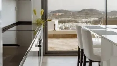 Duplex Penthouse with Dream Views: Infinite Mediterranean Sea Views - Camporosso Village, Finestrat 112 m² interior | 191.51 m² total built-up area | 170.27 m² usable surface 3 bedrooms | 3 bathrooms 82.56 m² of terraces, including a spectacular rooftop solarium of 43.82 m² with jacuzzi Stunning panoramic sea views 1 parking space included Energy Class A - Extremely energy efficient (30 kWh/m²/year) Layout: First Floor (74 m²): Open-plan living-dining room with modern kitchen, 2 bedrooms (master with en-suite bathroom), 2 bathrooms and 16 m² terrace with sea views. Second Floor (29 m²): Spacious third bedroom/multi-purpose room, bathroom, storage room, 16.60 m² terrace, plus an impressive rooftop solarium of 43.82 m² with 180° panoramic sea and Benidorm skyline views! Features: Air conditioning (heating/cooling) | Automatic awnings and electric shutters | Alarm system | Fully equipped modern kitchen | Parking space included | Energy rating A | All furniture included | Complete smart home system controllable via mobile app (electric shutters, all lights, air conditioning, door intercom and more) Community Services: Outdoor and heated swimming pools | Padel court | Gym | Children's playground | Gardens Privileged Location - Calle Colombia 2, Finestrat: 10 min to beaches | Shopping centres and supermarkets | Golf courses | Restaurants | Medical services and schools Perfect for: Families, investors, seekers of Mediterranean lifestyle, permanent or holiday residence, the best of life on the Costa Blanca. A Unique Opportunity: Modern duplex penthouse with A energy certification, huge private rooftop solarium with jacuzzi, smart home technology and all furniture included in one of the most complete urbanisations on the Costa Blanca. photo 112