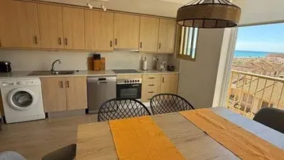 Duplex penthouse in Plaza Porticada, with 119 m² built area, 3 bedrooms, 2 bathrooms, good condition, floor 4, 2 wardrobes, 1 terrace(s), 25 m² of terrace, French kitchen, lift, 2006, green areas, 4 floors in the building, top floor, pets accepted. Duplex penthouse in Guardamar del Segura just 200m from the beach. The main floor features a living-dining room with side sea views, French kitchen, two bedrooms with fitted wardrobes, one bathroom. An internal staircase leads to the upper floor where there is a spacious bedroom with an en-suite bathroom and a private solarium of about 25m² with sea views. 119 m². There is also direct access to the communal solarium. In 2023, sold furnished and equipped. Close to all amenities. photo 12