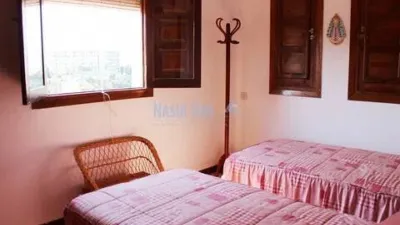 Semi-detached house in the Almijara urbanization, Nerja, with sea views. The property comprises a living room, kitchen, shower room, private patio, and a terrace on the ground floor. Three bedrooms and one bathroom on the first floor. There is also a basement converted into a small study. Parking and communal pool included. Sea views. photo 9