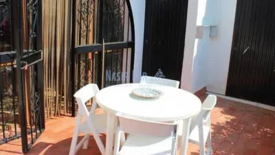 Semi-detached house in the Almijara urbanization, Nerja, with sea views. The property comprises a living room, kitchen, shower room, private patio, and a terrace on the ground floor. Three bedrooms and one bathroom on the first floor. There is also a basement converted into a small study. Parking and communal pool included. Sea views. photo 7