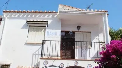 Semi-detached house in the Almijara urbanization, Nerja, with sea views. The property comprises a living room, kitchen, shower room, private patio, and a terrace on the ground floor. Three bedrooms and one bathroom on the first floor. There is also a basement converted into a small study. Parking and communal pool included. Sea views. photo 21