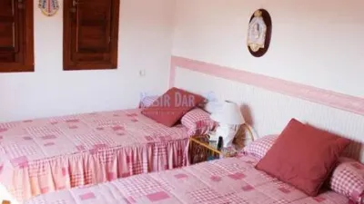 Semi-detached house in the Almijara urbanization, Nerja, with sea views. The property comprises a living room, kitchen, shower room, private patio, and a terrace on the ground floor. Three bedrooms and one bathroom on the first floor. There is also a basement converted into a small study. Parking and communal pool included. Sea views. photo 10