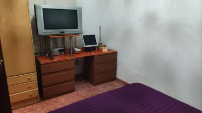 Ground floor flat with patio for sale in Figueres. The property comprises 100 m2, featuring 3 bedrooms, 1 full bathroom, a dining-living room with a fireplace, and an independent kitchen. The building includes a patio of approximately 100 m2[IW] photo 11