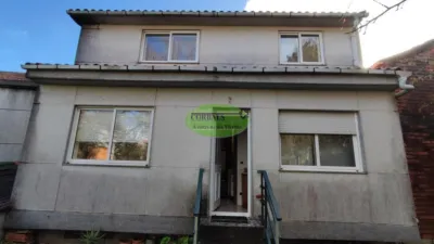 House for sale in Ramirás. House of approximately 300m2 distributed over three floors and with a small plot at the back of the property. The ground floor would be reserved for a large garage although it could also be converted into living space. The main floor is distributed in three bedrooms, all with built-in wardrobes, spacious lounge, and large kitchen fully furnished and equipped with appliances and finally a small ironing room with access to the rear garden of the house. On the second floor, still unfinished, we find three bedrooms, one with an en-suite bathroom, lounge with American-style kitchen with access to the terrace overlooking the front facade of the house and another small toilet. photo 24