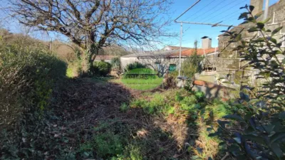 Stone house with land for sale in the Xinzo area. With just over 280m², we find this stone property located 5km from the centre of Xinzo de Limia, distributed over two floors and with a plot of 700m². Ground floor: We have two independent units totalling 182m², one of which serves as a garage and features internal stairs leading to the upper floor of the house. Main floor: Accessible also from the exterior, this level offers just over 100m² with 3 bedrooms, 1 bathroom, living room and kitchen. The aforementioned property includes a well and sheds previously used for farming tools and livestock. The house requires minor updating. The property is registered, facilitating future mortgage approval. View this and other properties on our website. photo 11