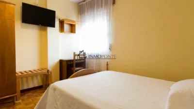 Hotel for sale in A Estrada, located on one of the routes of the Camino de Santiago. It comprises 16 bedrooms, 10 with private bathrooms and 6 with two shared bathrooms. Additionally, it features two spacious halls of 250 m² and 120 m², perfect for events, celebrations or catering. On the first floor are the reception, lounge, bar, café, terrace and a fully equipped industrial kitchen. The ground floor houses the laundry room, wine cellar, cold storage rooms and a storage area. The hotel is fitted with solar panels for hot water and a 10,000-litre diesel tank, ensuring energy efficiency and autonomy. Its excellent location, functionality and capacity make it a unique investment opportunity in tourism in one of the most visited areas of Galicia. For more information, contact us at INMOPONTE PEREGRINA 63 PONTEVEDRA photo 41